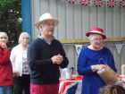 Jeff Souch, Parish Chairman, and Angela Avens, Parish Clerk, handing out the commemorative medals to the children